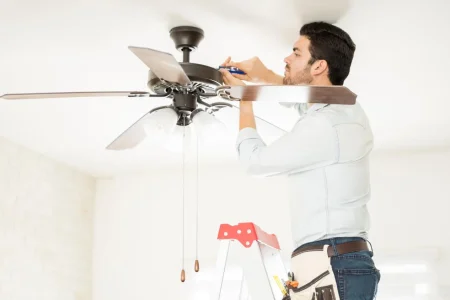 Handyman-installing-ceiling-fan-